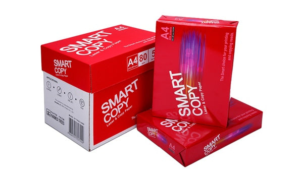 Smart Copy A4 80gsm copy paper carton with two red wrapped reams beside it, showing printer application icons on the carton side