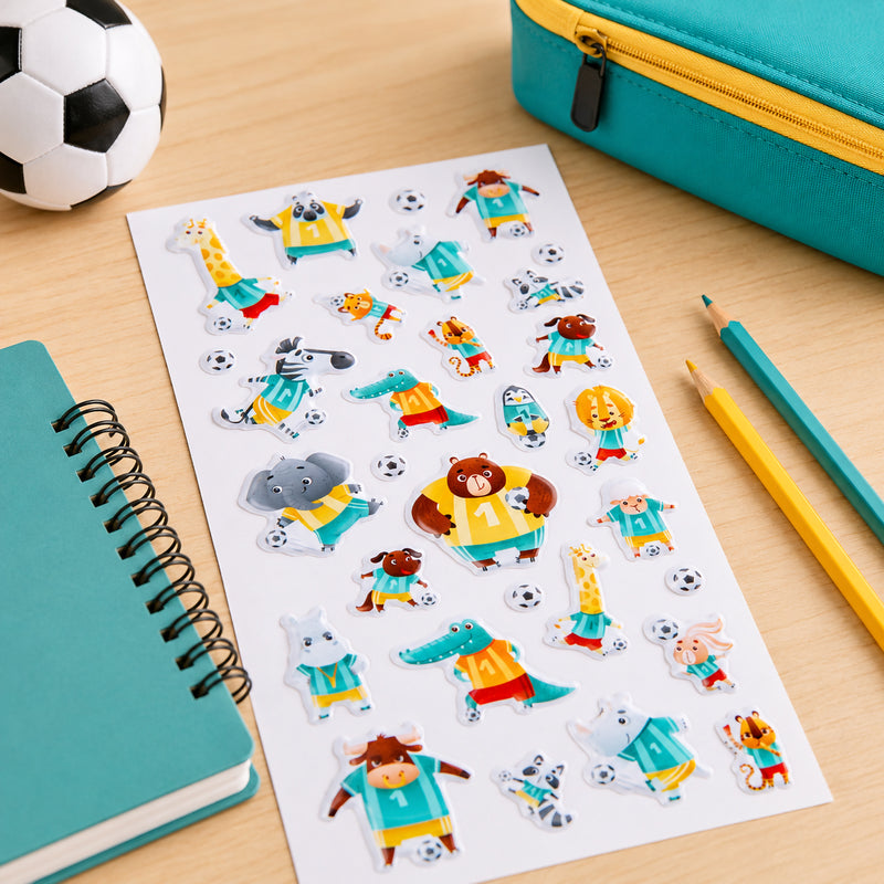 Full sticker sheet featuring 30 puffy stickers with cheerful animal athletes including bears, elephants, crocodiles, giraffes, zebras and lions. Each character is dressed in soccer uniforms and posed in action packed sporting scenes.