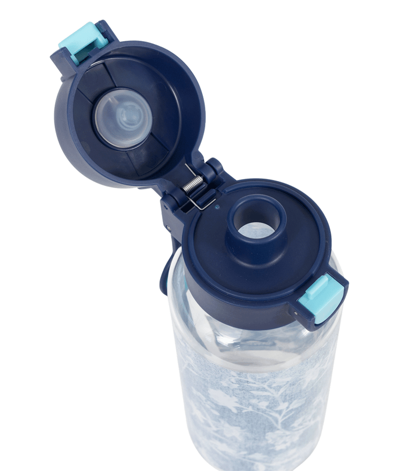 Spencil Denim Daze Big Water Bottle 650ml, close-up from above with the lid open showing the spout and seal, pale denim-blue print with white botanical sprigs, navy lid with light blue clip