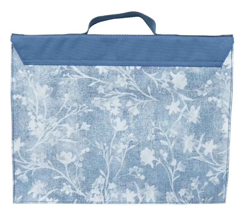 Back of the Spencil Denim Daze library bag with the denim floral print running across the panel beneath the plain fold-over flap and top handle