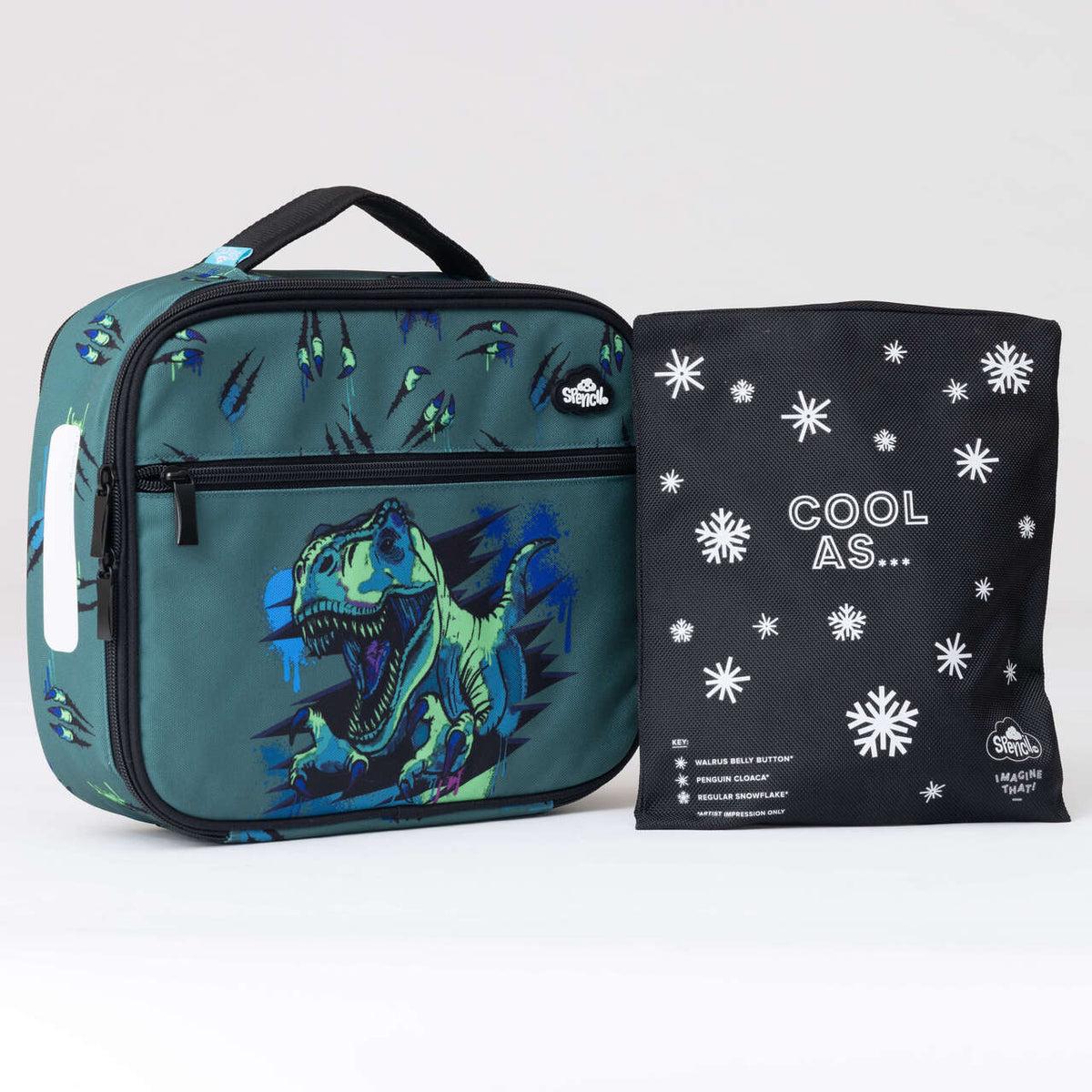 Spencil Raptor Rampage Big Cooler Lunch Bag photographed beside the Big Chill Pack in its black snowflake cover, showing the dark forest green bag with a roaring dinosaur bursting through claw-ripped fabric, with black trim