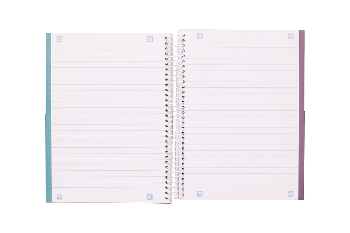 Spirax 572 A5 notebook opened to two ruled pages with small scan markers in each corner and a date line at the top, teal and purple card edges showing at the outer sides