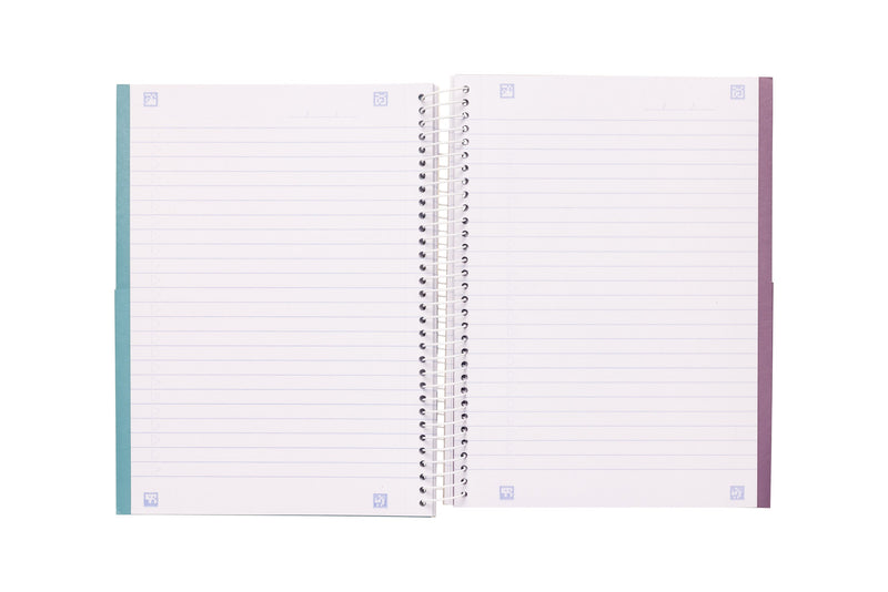Spirax 572 A5 notebook opened to two ruled pages with small scan markers in each corner and a date line at the top, teal and purple card edges showing at the outer sides