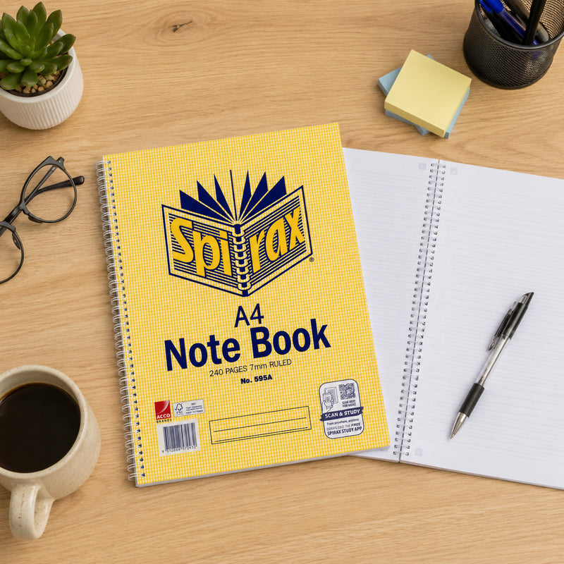 Top view of the Spirax 595A A4 240 page notebook beside an open ruled notebook, pen, glasses, coffee cup, plant and desk accessories, highlighting everyday study and workplace use.