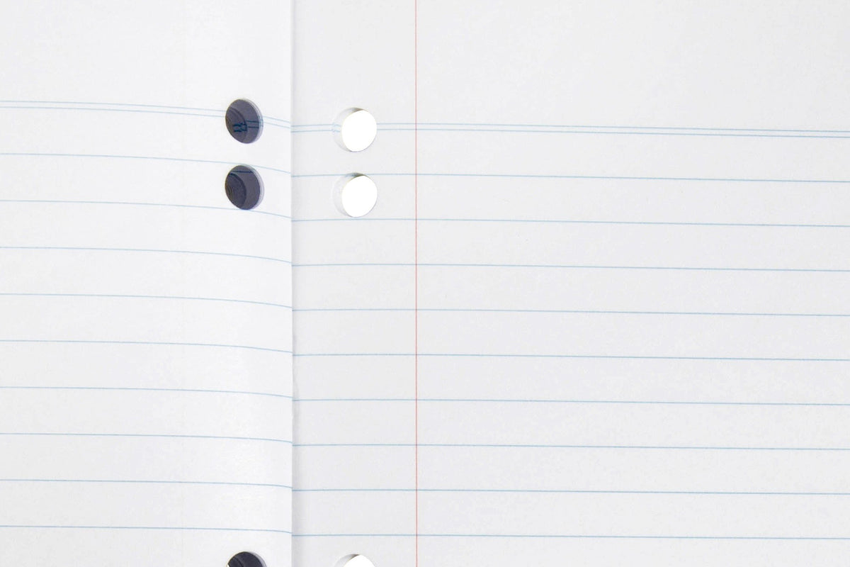Close-up of the Spirax 120 binder book page showing 8mm ruled blue lines, a red margin line and punched binder holes along the inner edge
