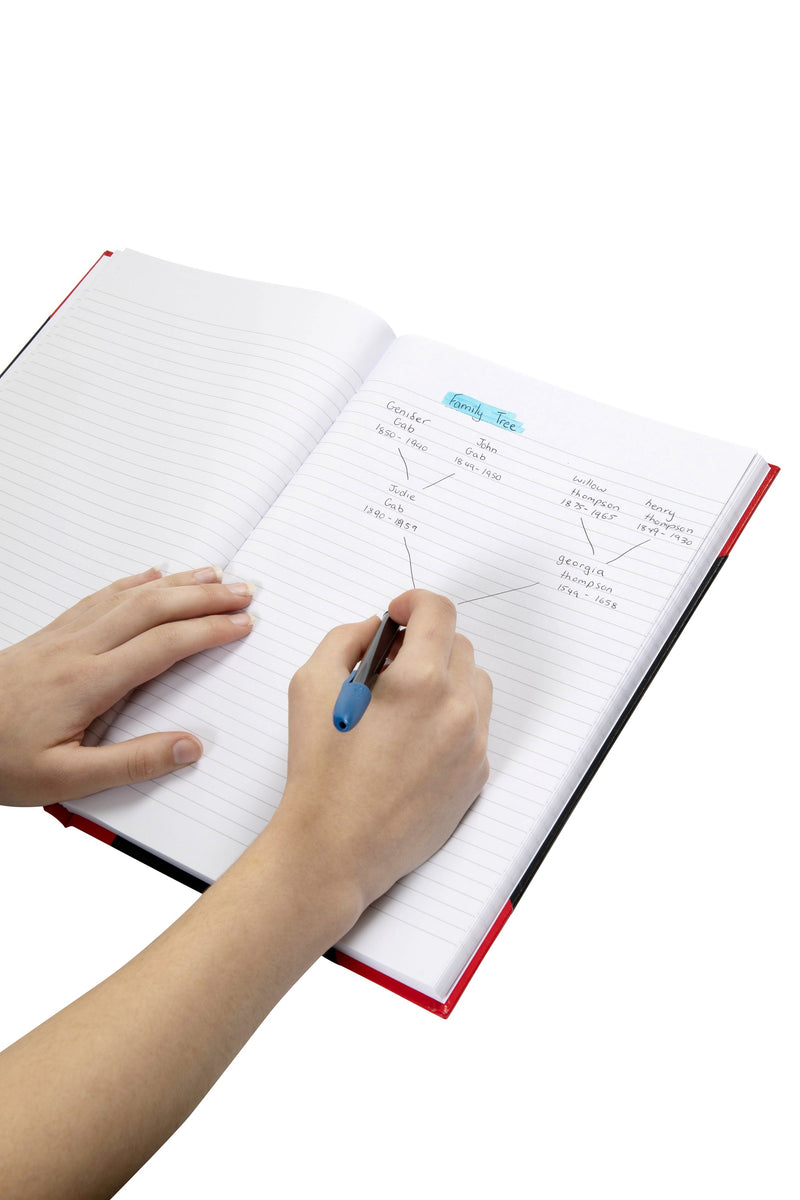 Hand drawing a family tree in pen on the ruled page of an open Spirax black and red casebound A4 notebook, with the red and black cover edge showing