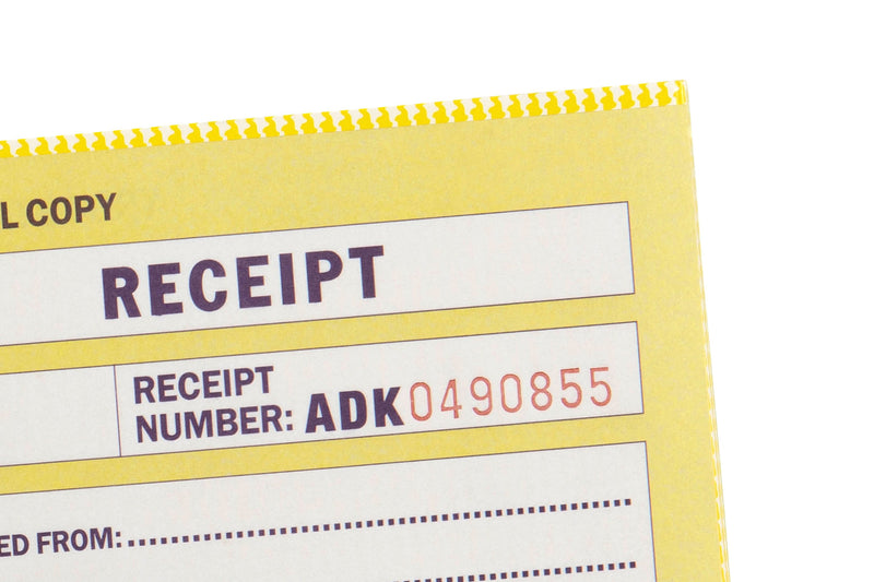 Close-up of a Spirax 504 yellow receipt form showing the Receipt Number box with its sequential number printed in red