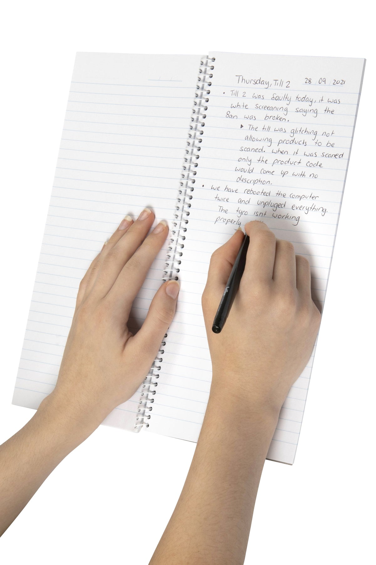 Hand writing notes in pen on the feint ruled pages of a tall Spirax counter book opened flat on its white spiral