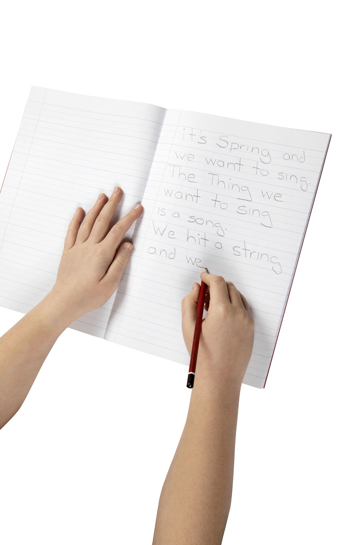 Child writing in pencil between the 24mm dotted thirds lines of an open Spirax P105 exercise book, one hand holding the page flat