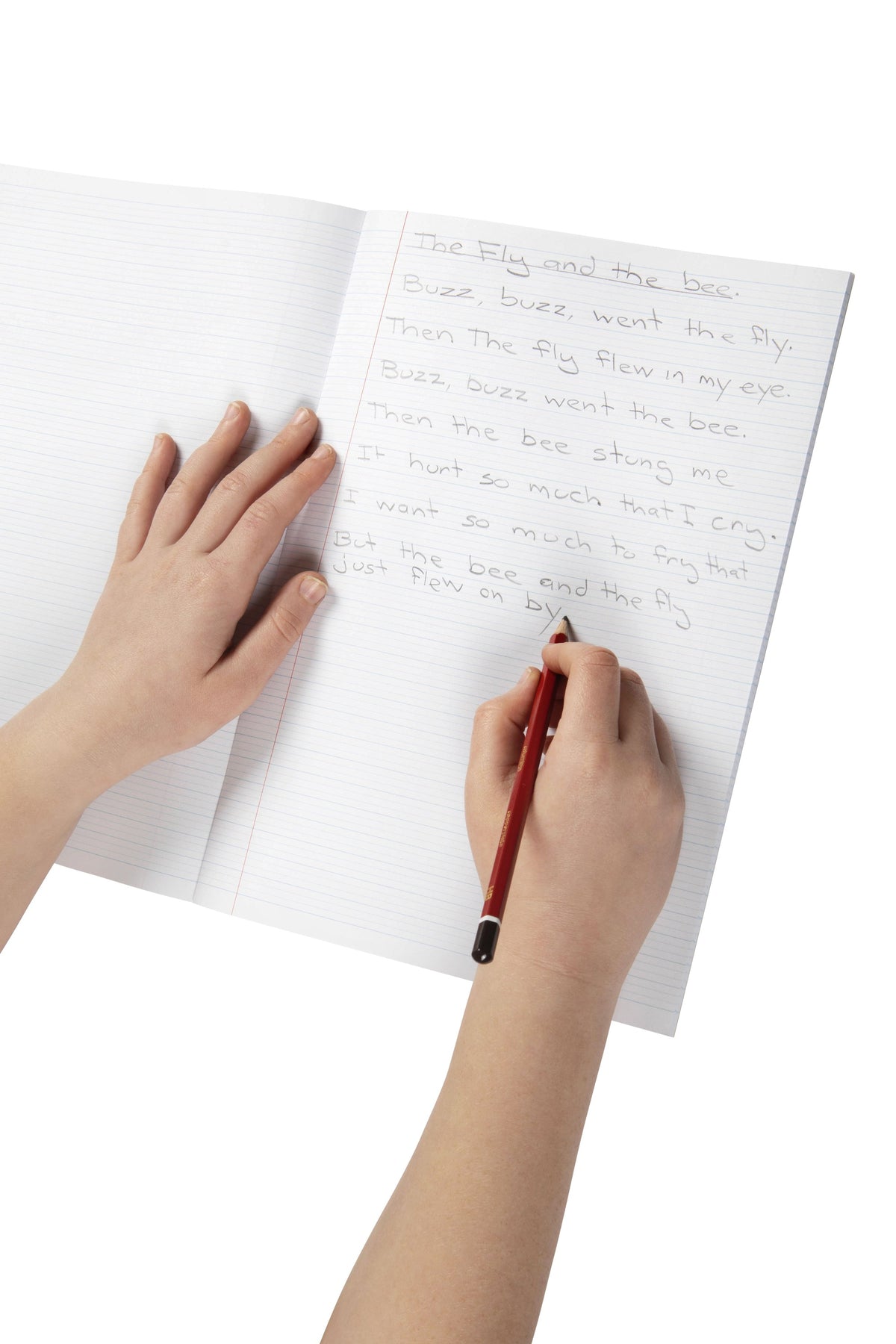 Child writing sentences in pencil on the 9mm dotted thirds lines of an open Spirax P115 A4 exercise book, left hand steadying the page