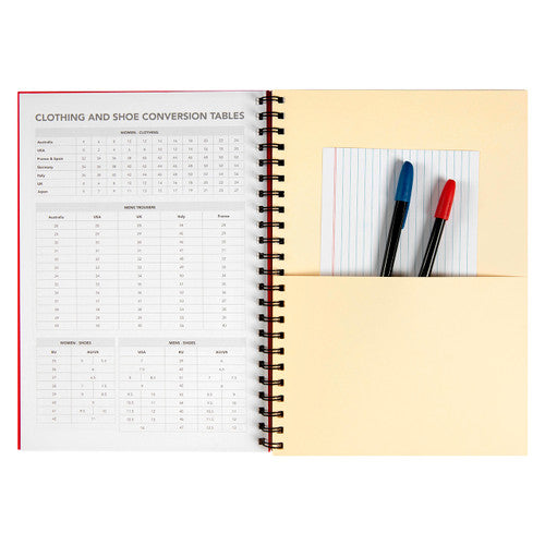 Spirax red hardcover notebook lying flat open on a office desk