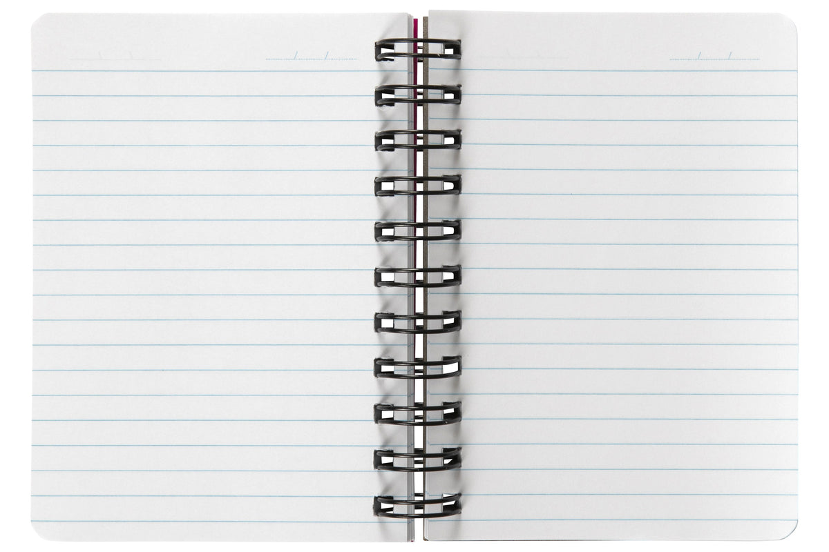 Spirax Kode P962 solid notebook lying open on its black wire, both pages ruled in light blue with no margin and a date line at the top