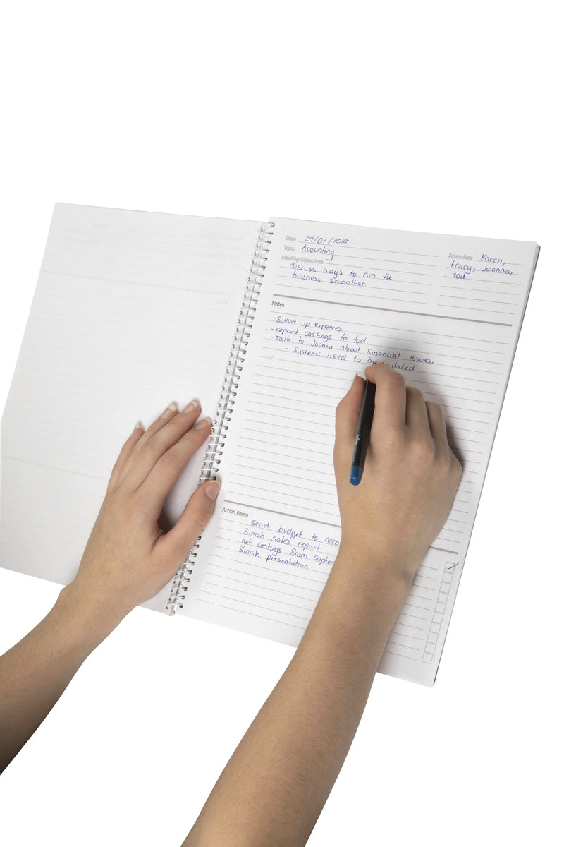 Hand writing meeting notes into the ruled notes section of a template page in an open Spirax 705 A4 meeting book, with action items below