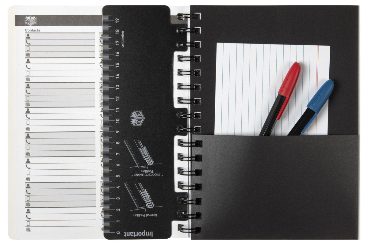 ACCO photo of the Spirax 701 opened at the front, showing a printed Contacts page, the black centimetre ruler divider and a black pocket holding a ruled card and two pens