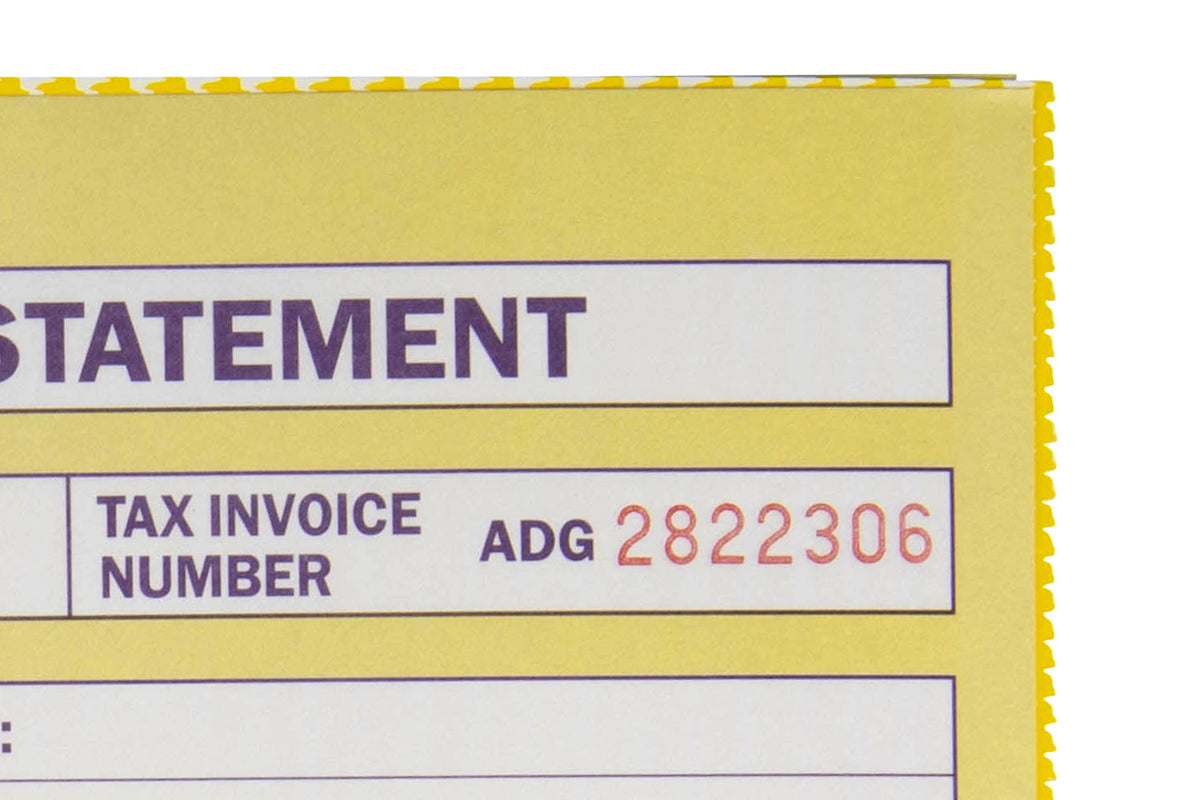 Close-up of a Spirax 500 yellow tax invoice form showing the Tax Invoice Number box with its sequential number printed in red