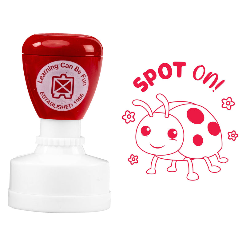Product image showing the self inking merit stamp alongside the complete Spot On! ladybird artwork. The bold red design highlights the playful reward message and demonstrates the clear impression produced on student worksheets and assignments.