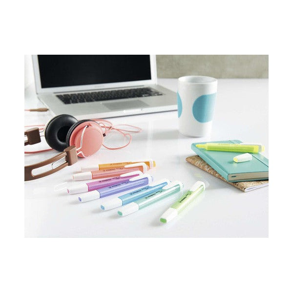 Stabilo Swing Cool green highlighter in hand marking key words on a page