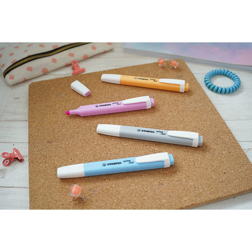Stabilo Swing Cool Pastel Peach highlighter uncapped next to highlighted study notes