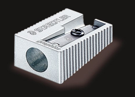 Staedtler 510 10 metal sharpener at an angle showing the single round hole and ridged sides