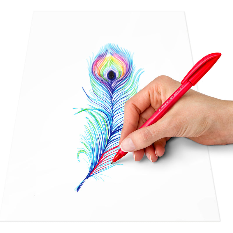 Hand writing with a red Staedtler ball 4320 pen beside a peacock feather drawing, showing the triangular grip in use