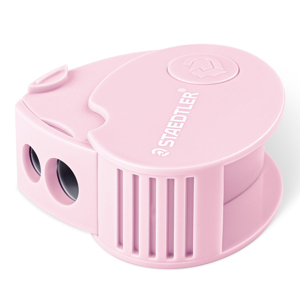 Pastel pink Staedtler covered sharpener, rounded body with ribbed sides, two holes at the front and STAEDTLER moulded on the lid