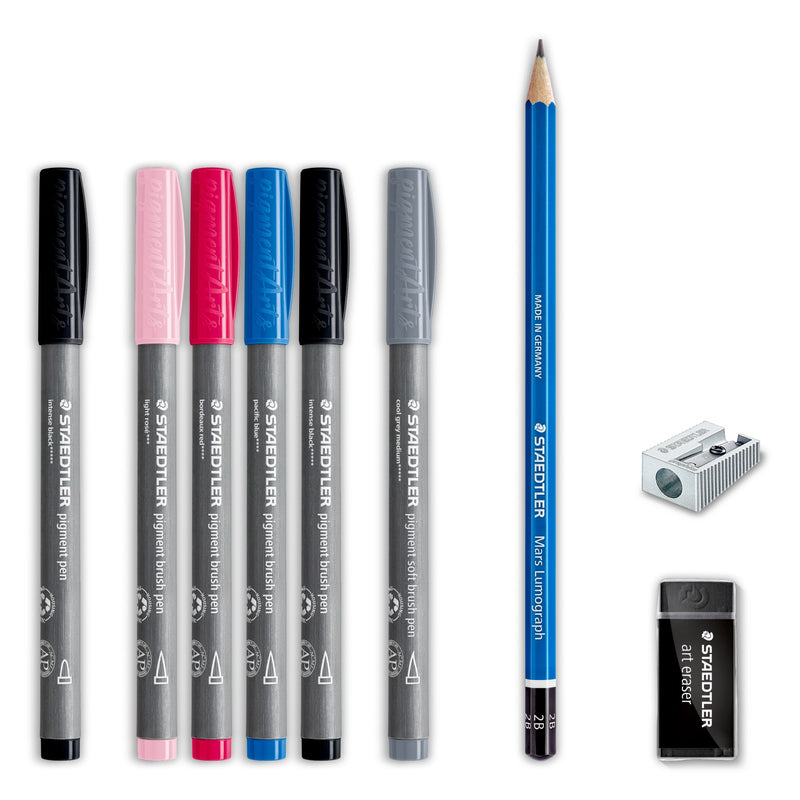 Contents laid out: six Staedtler Multi Ink pens with black, light pink, deep pink, blue, black and grey caps, a blue pencil, metal sharpener and art eraser