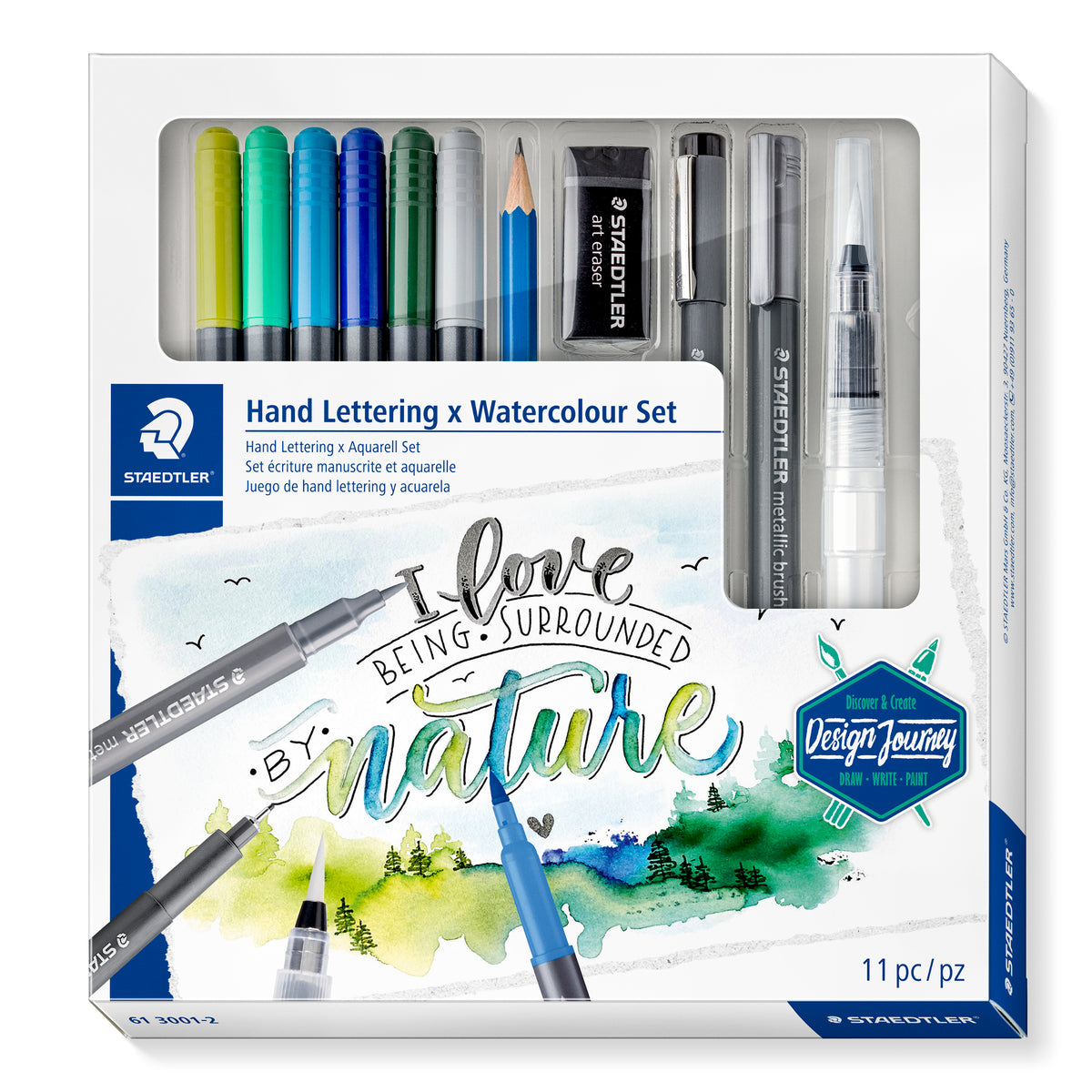 Staedtler Hand Lettering x Watercolour Set box marked 11 pc, with a window showing brush pens, pencil, eraser, liner, metallic brush and water brush above watercolour lettering art