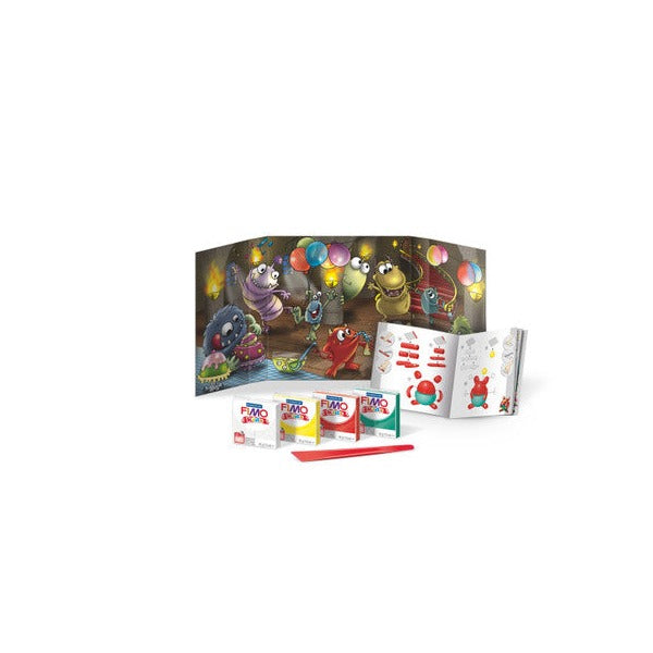 Monster set contents from the earlier pack: party backdrop, booklet, red stick and white, yellow, red and green clay blocks