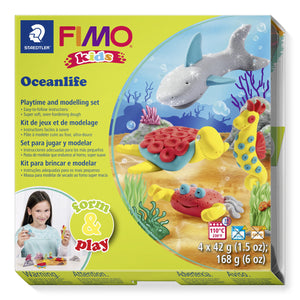 FIMO kids form and play Oceanlife box with a clay shark, turtle, yellow seahorse and red crab on a sandy seabed