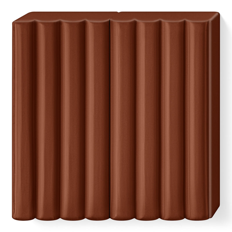 Unwrapped brown FIMO kids block 8030-7 with its ribbed segments, ready to break into portions