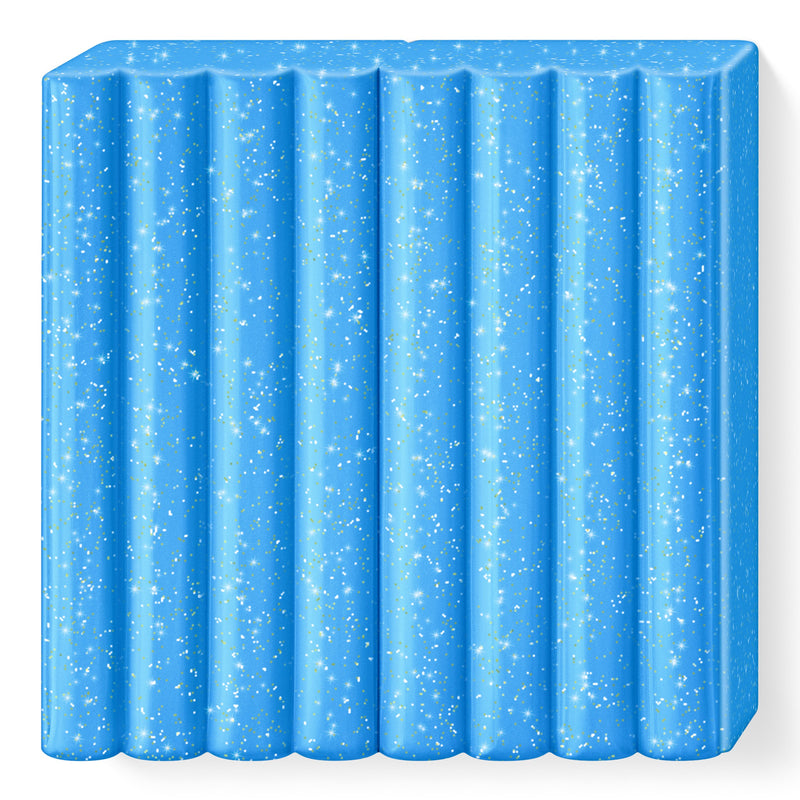 Unwrapped glitter blue FIMO kids block 8030-312 with fine sparkles visible across its 8 ribbed segments