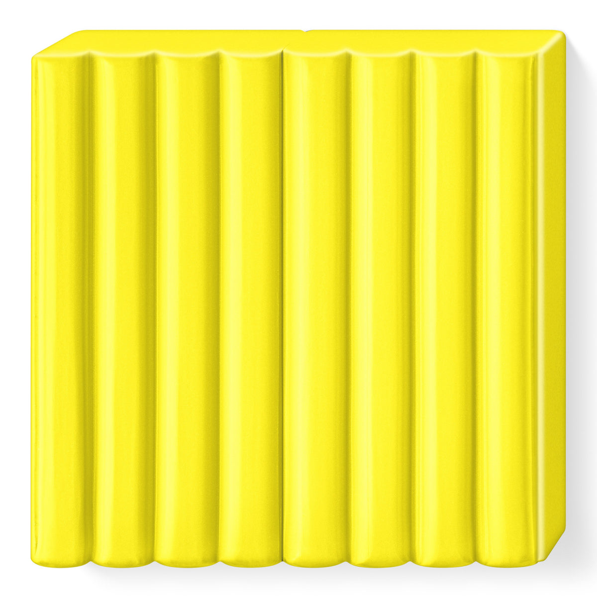 Unwrapped yellow FIMO kids block showing the ribbed top that divides it into 8 portions