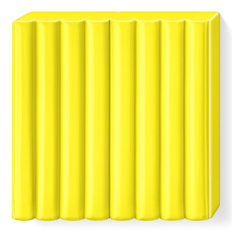 Unwrapped yellow FIMO kids block showing the ribbed top that divides it into 8 portions