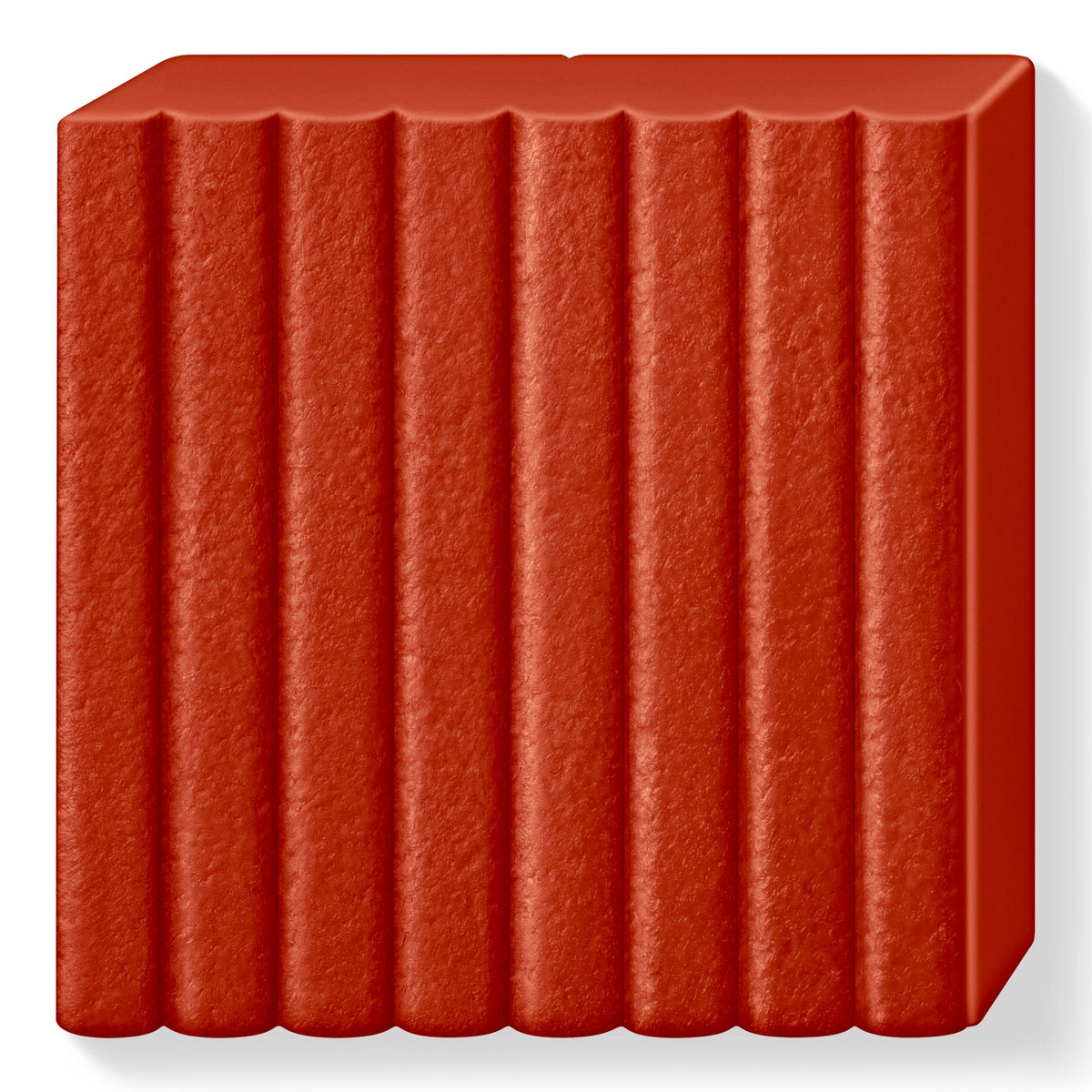 Unwrapped rust FIMO leather-effect block showing a fine leather-grain surface across its 8 ribbed sections