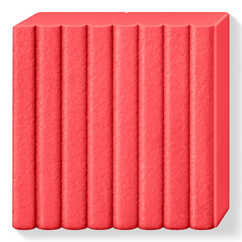 Unwrapped watermelon FIMO leather-effect block showing a fine leather-grain surface across its 8 ribbed sections