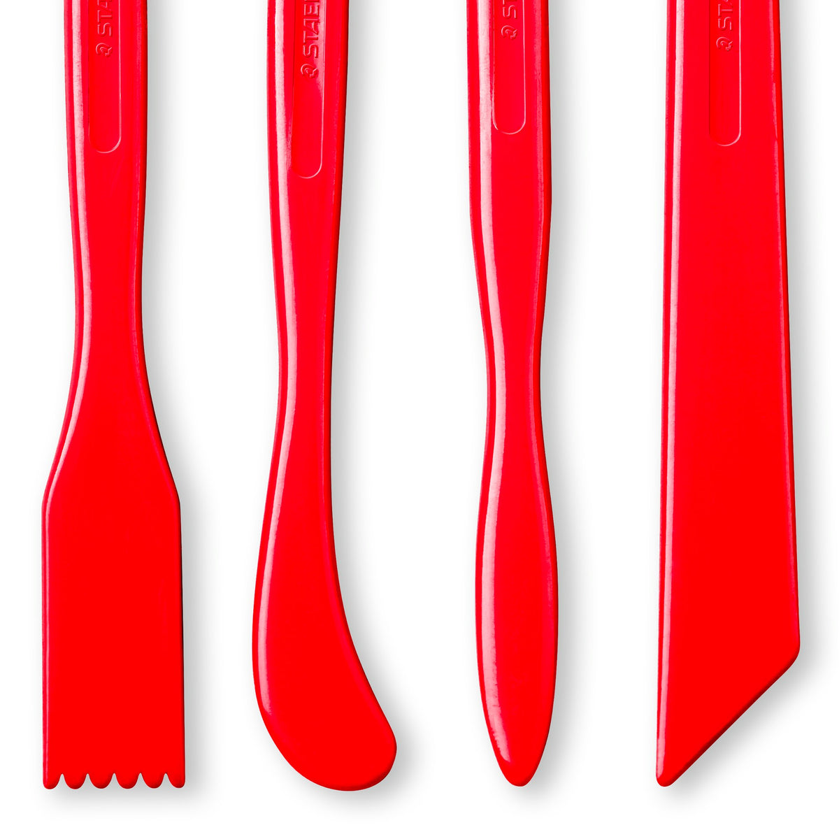 Lower ends of the four red FIMO modelling sticks: a comb end with teeth, a curved spatula, a leaf shaped tip and an angled blade