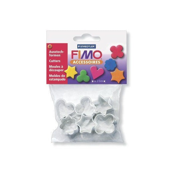 Smaller photo of the earlier FIMO Accessoires cutter bag showing the heart, star and flower cutters inside