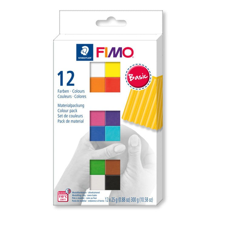 Earlier box design of the FIMO soft 12 colour pack with a hand shaping yellow clay, shown as previous packaging