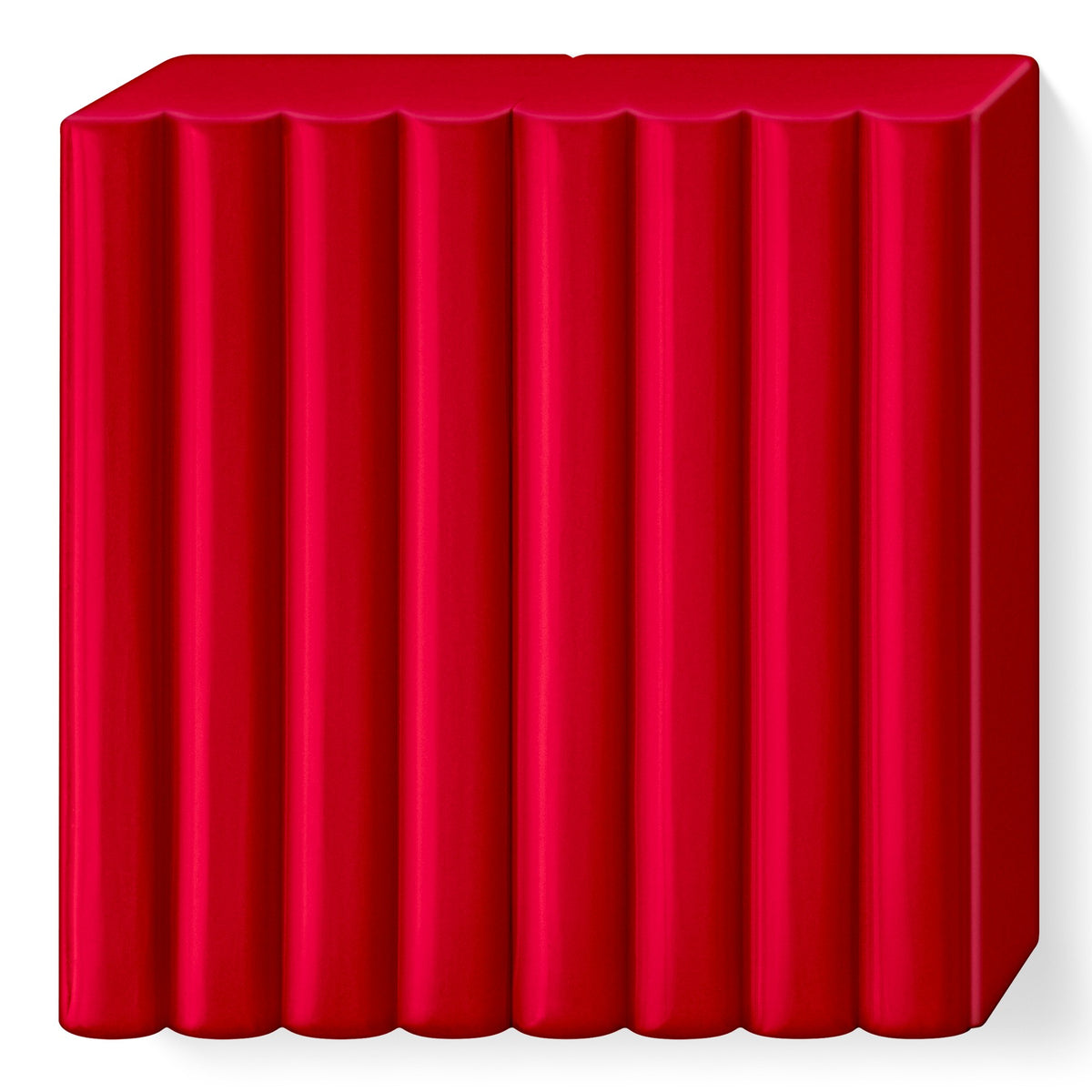 Cherry red FIMO soft block unwrapped, showing its 8 scored portions in a deep, slightly cool red