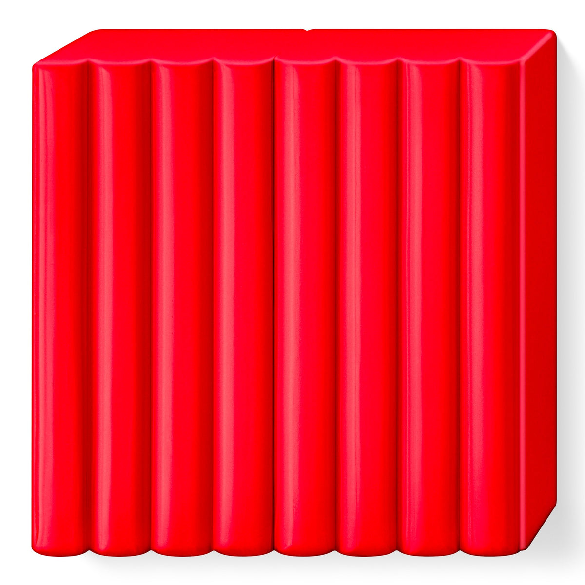 FIMO soft indian red block without wrapper, divided into 8 scored portions in a clear warm red
