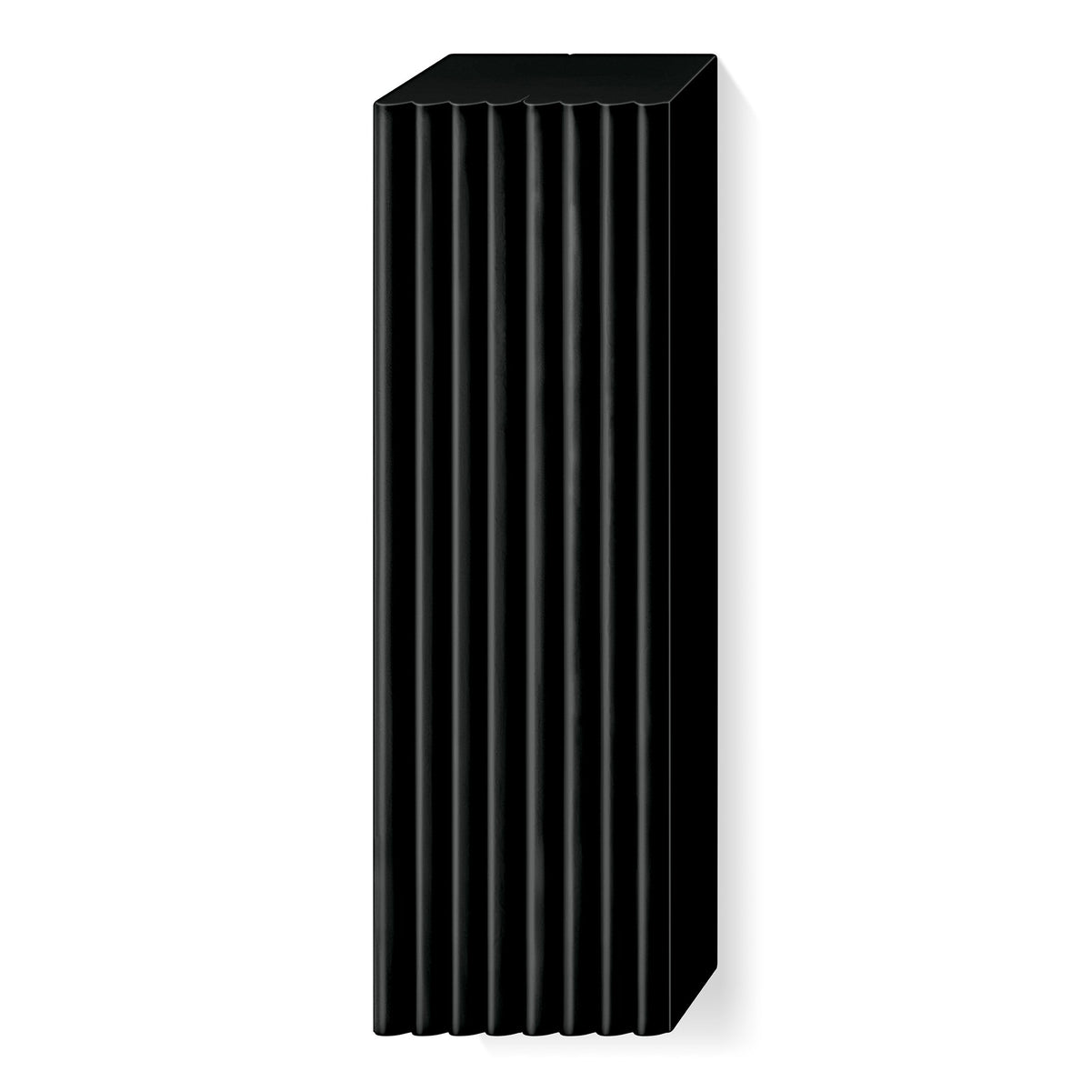 Unwrapped black FIMO soft large block with ridged lines marking its portions