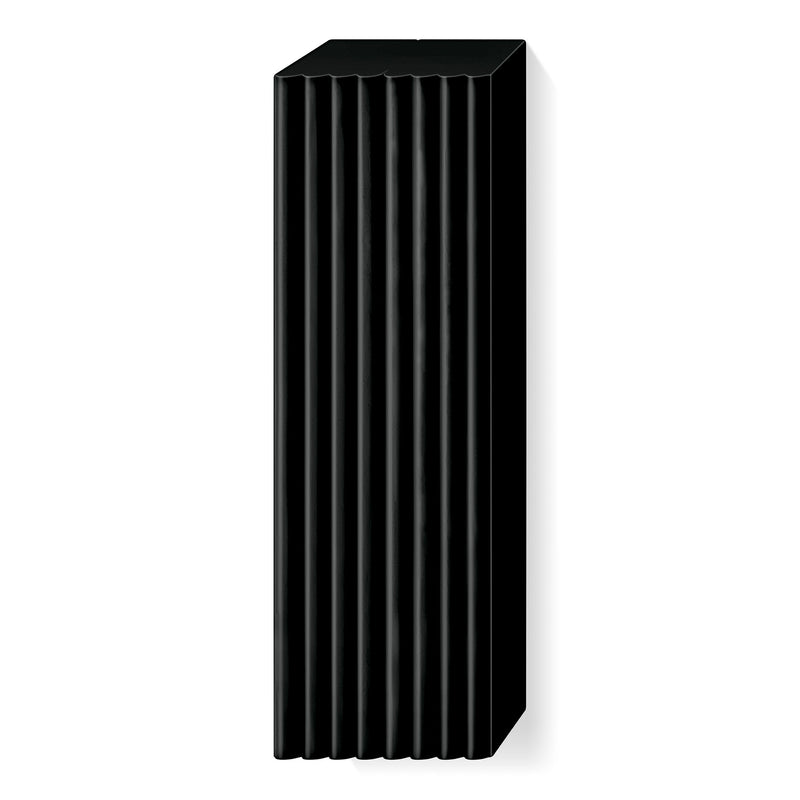 Unwrapped black FIMO soft large block with ridged lines marking its portions