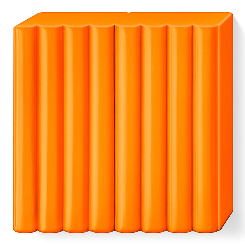 Bright orange FIMO soft tangerine block out of the pack, scored into 8 portions