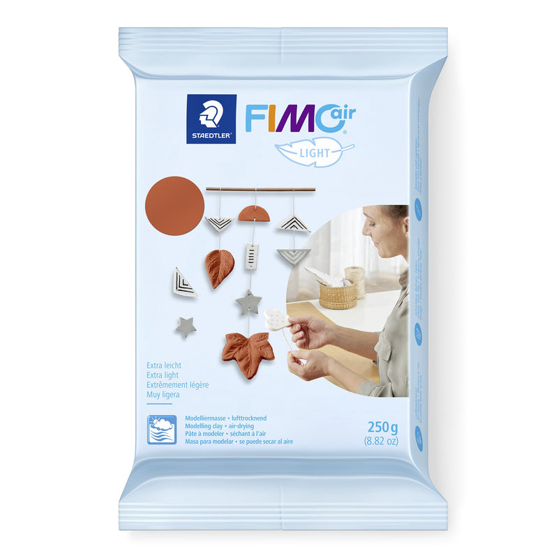 Staedtler FIMOair light 250g pack in terracotta, pale blue foil wrapper with a terracotta swatch and photos of hanging leaf and star decorations