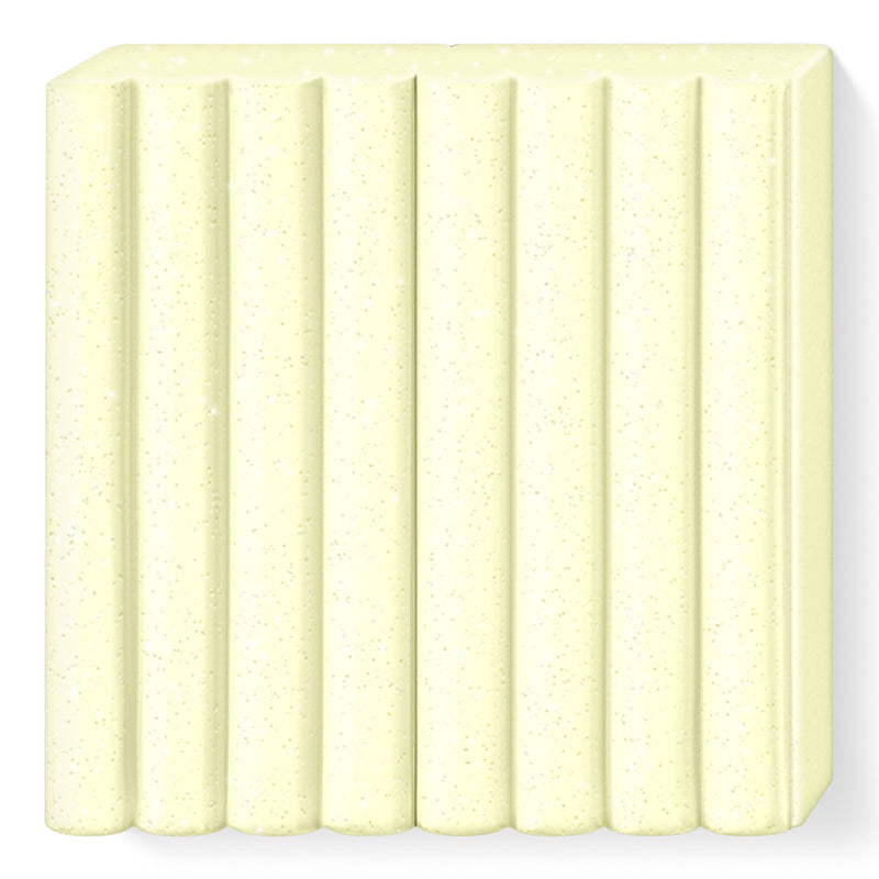 Unwrapped pearl yellow FIMO kids block, pale lemon with a fine shimmer, in 8 ribbed segments