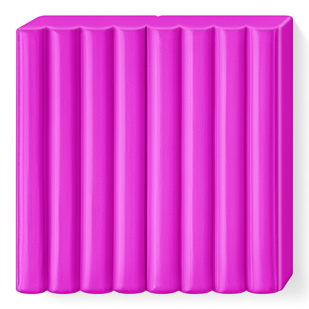Unwrapped bright pink FIMO kids block divided into 8 ribbed segments