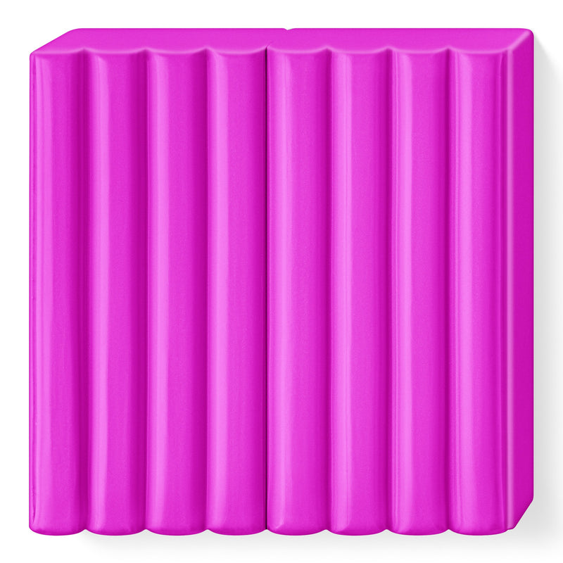 Unwrapped bright pink FIMO kids block divided into 8 ribbed segments