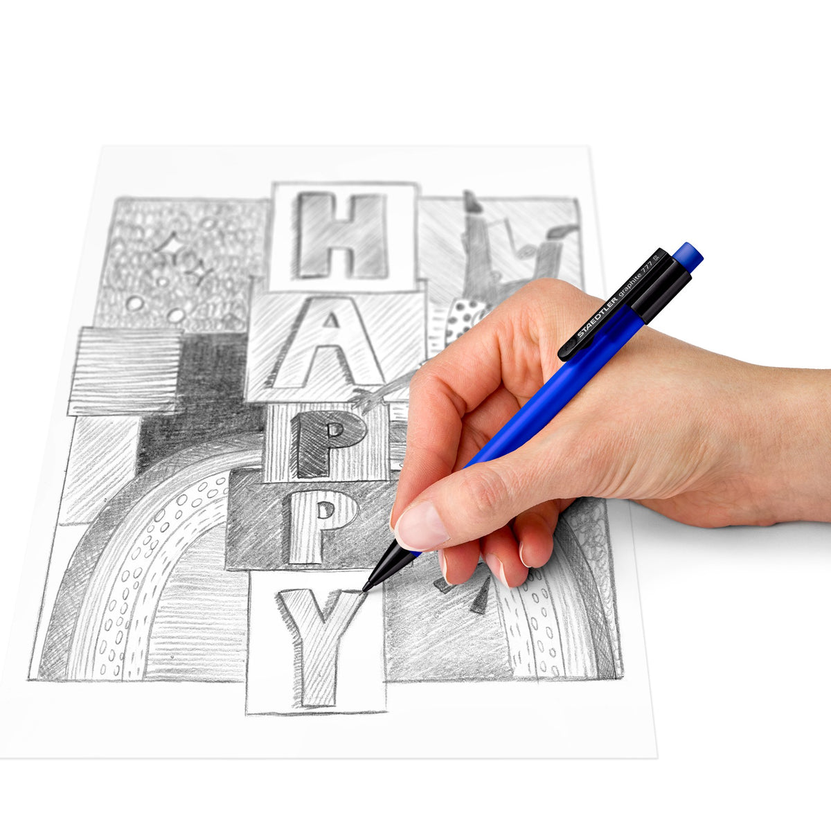 Hand shading block letters with a blue graphite 777 mechanical pencil, Staedtler range photo