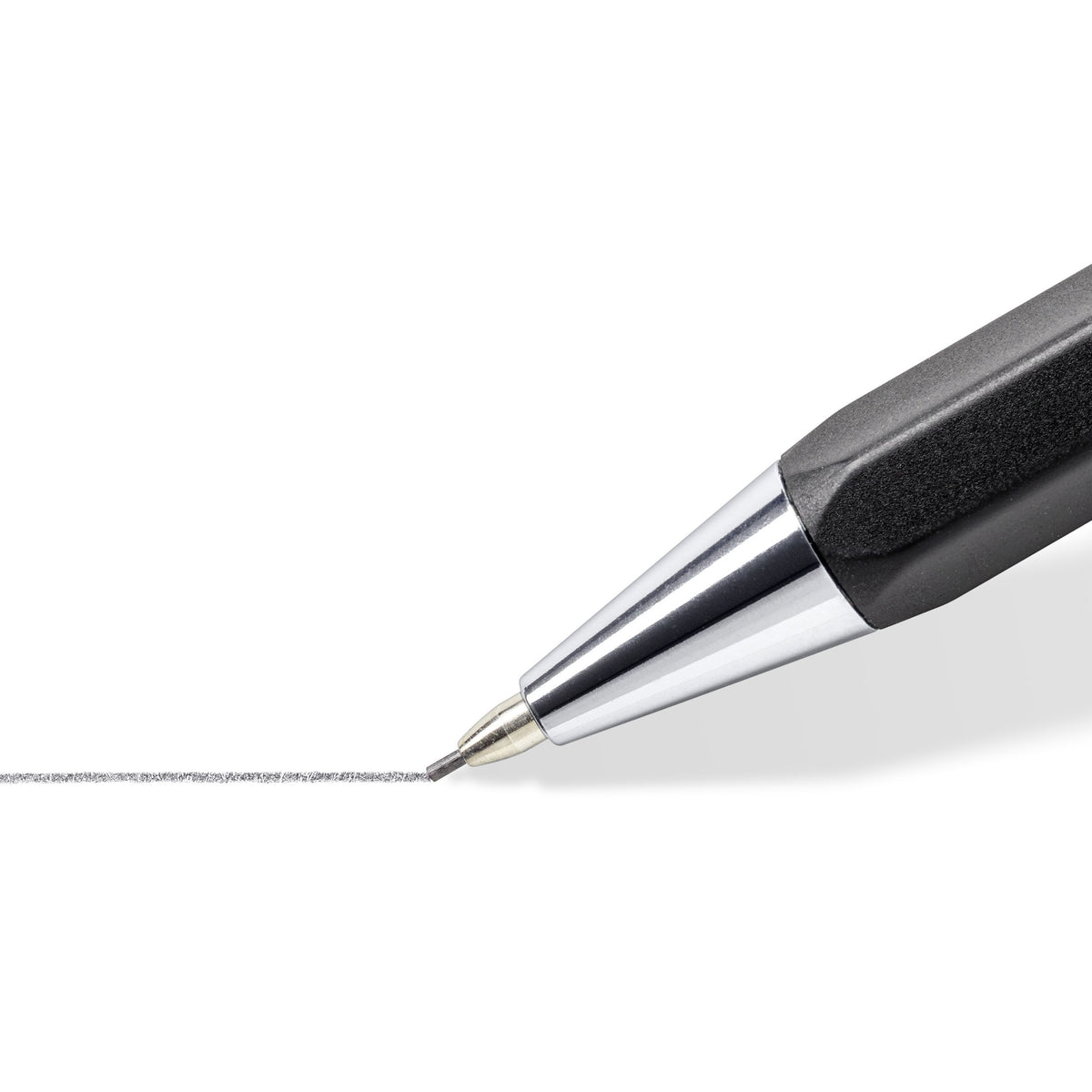 Close-up of the graphite 778 metal tip and lead drawing a fine grey line