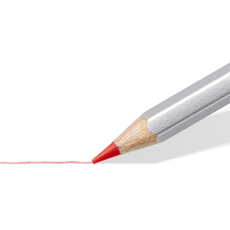 Red karat aquarell lead in close-up drawing a thin line on white paper